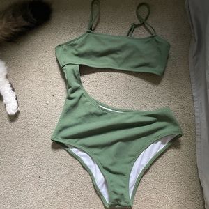 cute green one piece with cutout